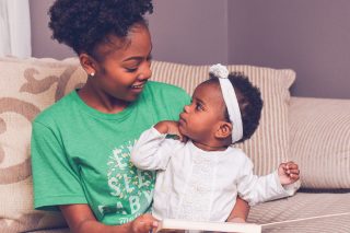 babysitter reading book to child